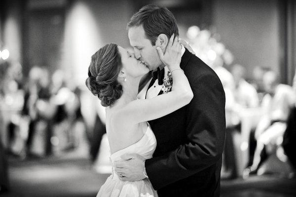 The newlyweds share a kiss - wedding photo by top Atlanta-based wedding photographer Scott Hopkins Photography